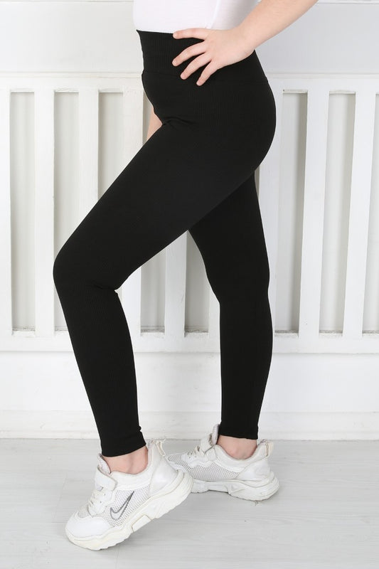 Siyah renkli, yüksek belli ve fitilli kumaştan üretilmiş kız çocuk günlük tayt.