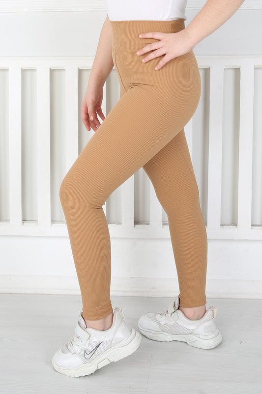 Hardal rengi, yüksek belli, fitilli kumaştan üretilmiş dar paça kız çocuk taytı.