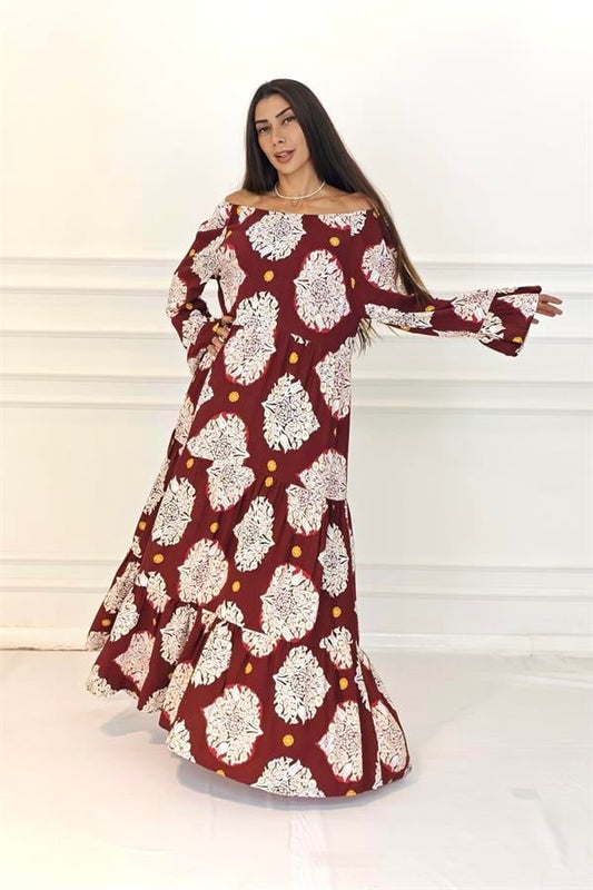 Bordo renkli, madonna yakalı, beyaz desenli ve kat kat etekli uzun viskon elbise.