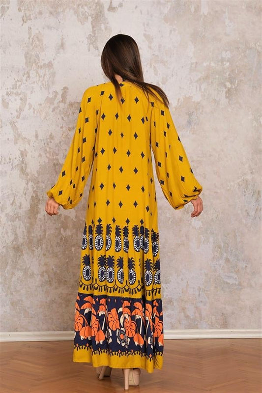 Hardal rengi, etnik desenli, balon kollu ve kat kat etekli uzun viskon elbise.