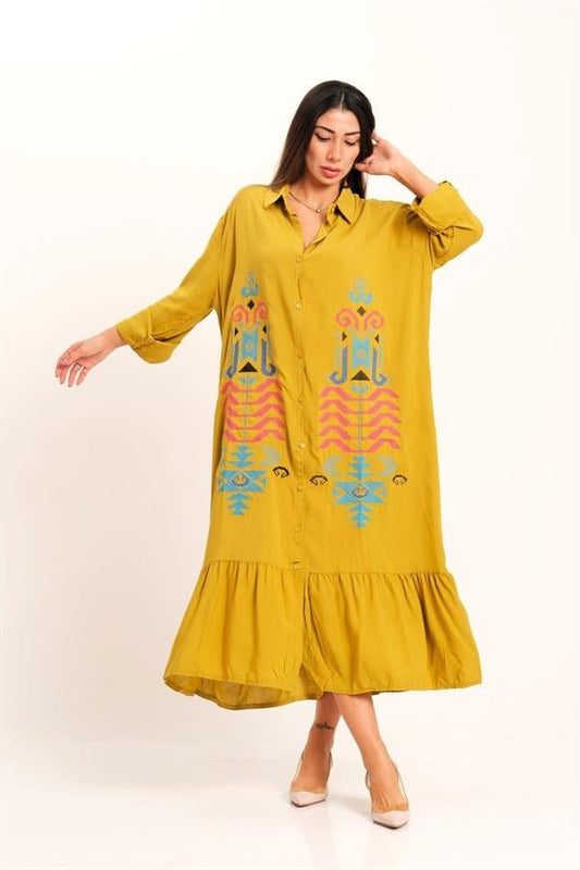 Mustard yellow long shirt dress with authentic embroidery, button front, and ruffled hem.