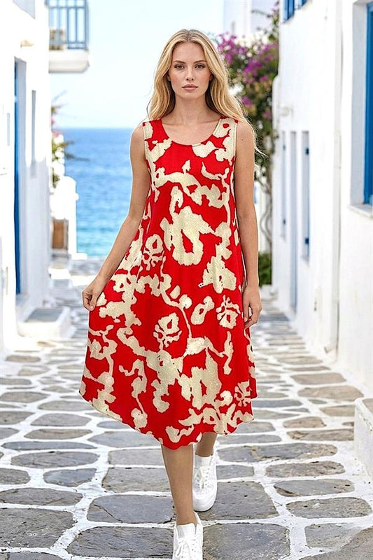 Kırmızı zemin üzerine bej desenli, kalın askılı, viskon kumaştan midi boy elbise.