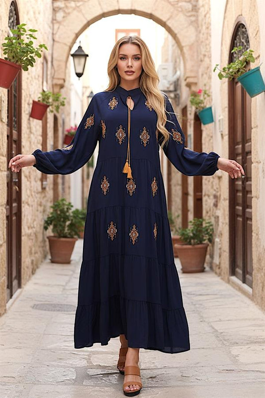 Lacivert, önü ve kolları otantik nakışlı, püskül bağcıklı, kat kat uzun viskon elbise.