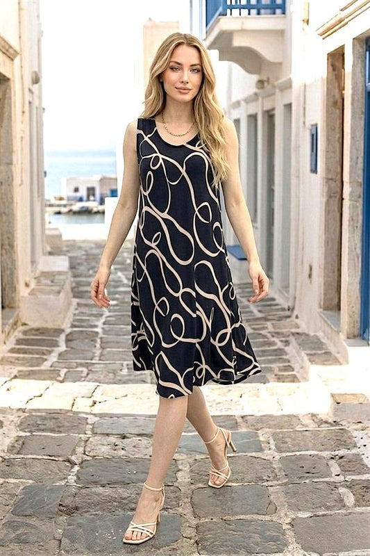 Siyah zemin üzerine bej renkli kıvrımlı desenlere sahip, kalın askılı midi boy viskon elbise.