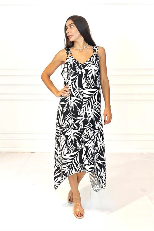 Siyah beyaz yaprak desenli, askıları halka detaylı, asimetrik kesim uzun viskon elbise.