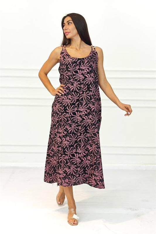 Siyah zemin üzerine pembe palmiye desenli, boncuk detaylı askılara sahip uzun viskon elbise.