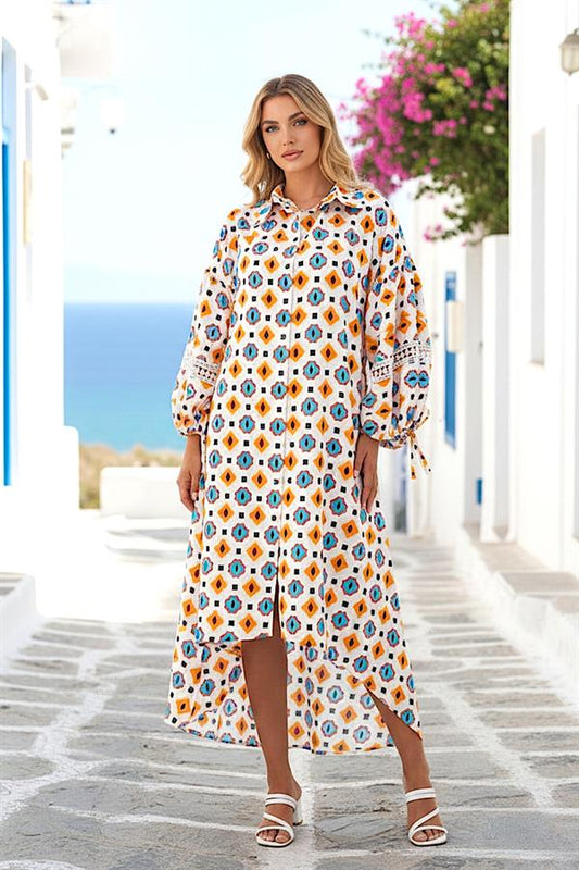 Turuncu ve mavi geometrik desenli, balon kollu, fisto detaylı, yüksek-alçak etekli gömlek elbise.