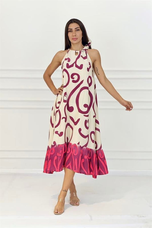 Fuşya desenli, boyundan bağlamalı, fırfır detaylı ve uzun viskon elbise.