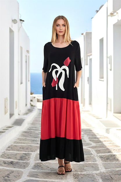 Kırmızı ve siyah renkli, lale nakışlı, kısa kollu, cepli ve uzun viskon elbise.
