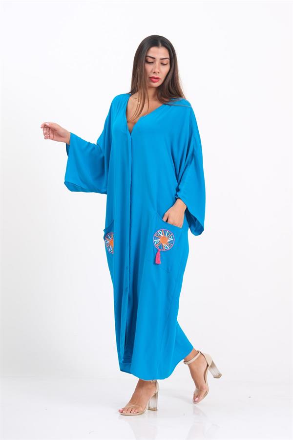 A model wears a blue V-neck oversized long dress with embroidered pockets and tassels.