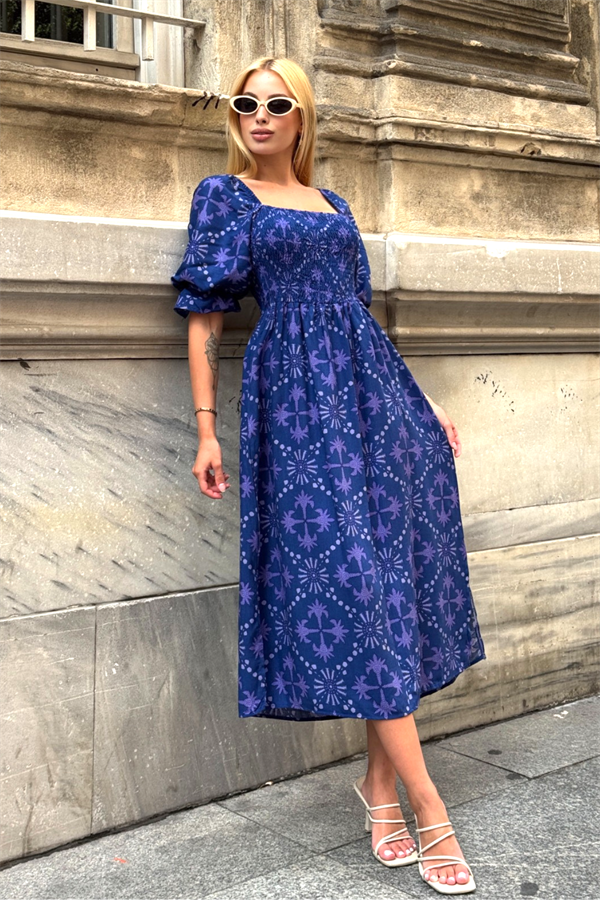 Mor desenli, karpuz kollu ve gipeli detaylara sahip uzun viskon elbise.