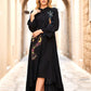 Siyah renkli, dik yakalı, önü nakışlı, volanlı kollu ve asimetrik etek uçlu uzun viskon elbise.