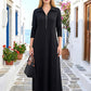Siyah renkli, yakası fermuarlı, uzun kollu ve modal kumaştan üretilmiş uzun elbise.